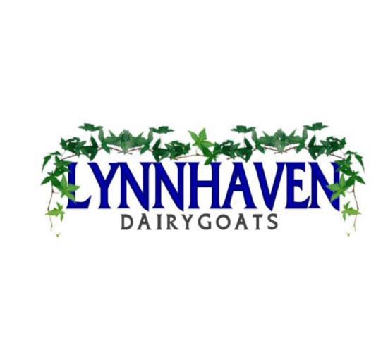 logo blue lettering with greenery surrounding. 
