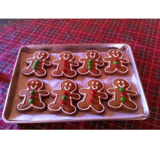 gingerbread men cookies 8 of them on a cookie tray decorated
