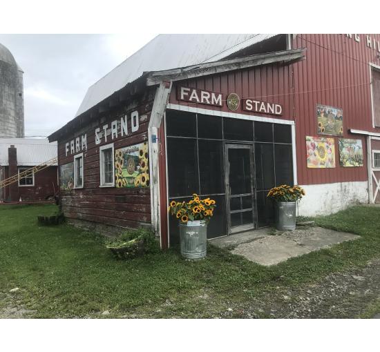 image of farm stand red barn with images on farm