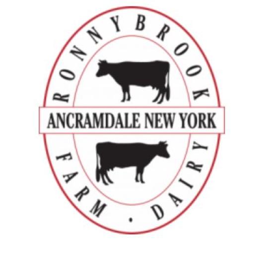 logo red oval with 2 cows one on top one on bottom with name of town in middle and name of company around