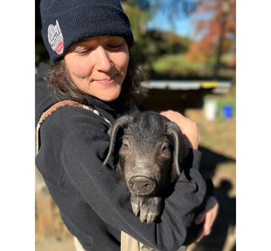 Kristin holding a pig