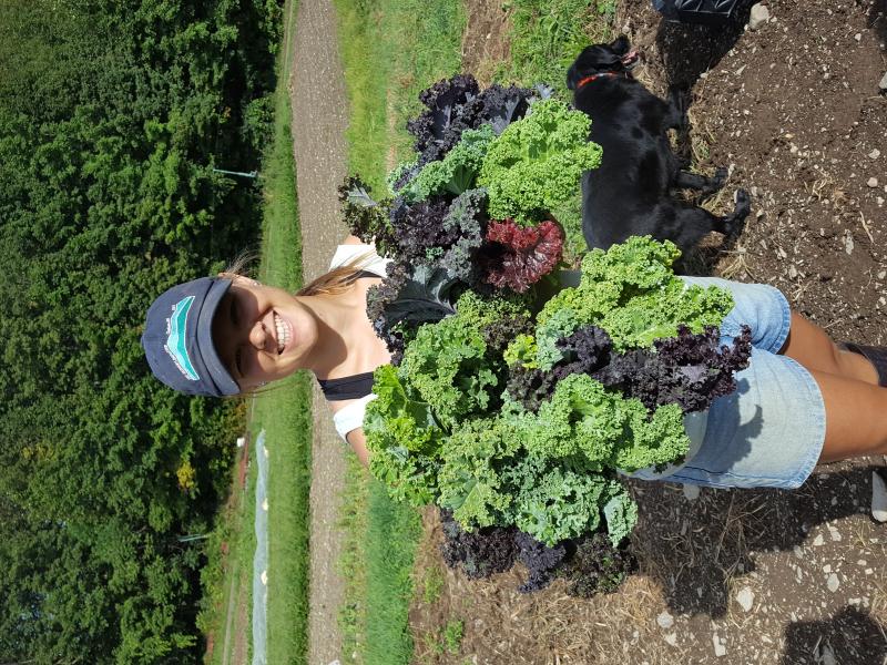 Annie Metzger From Laughing Earth Farm Holding Kale