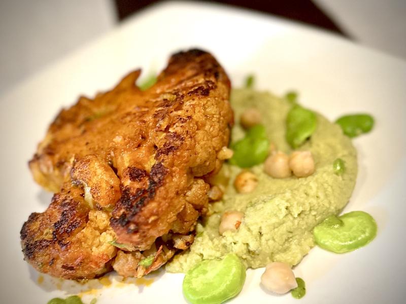 cauliflower steak with hummus plated