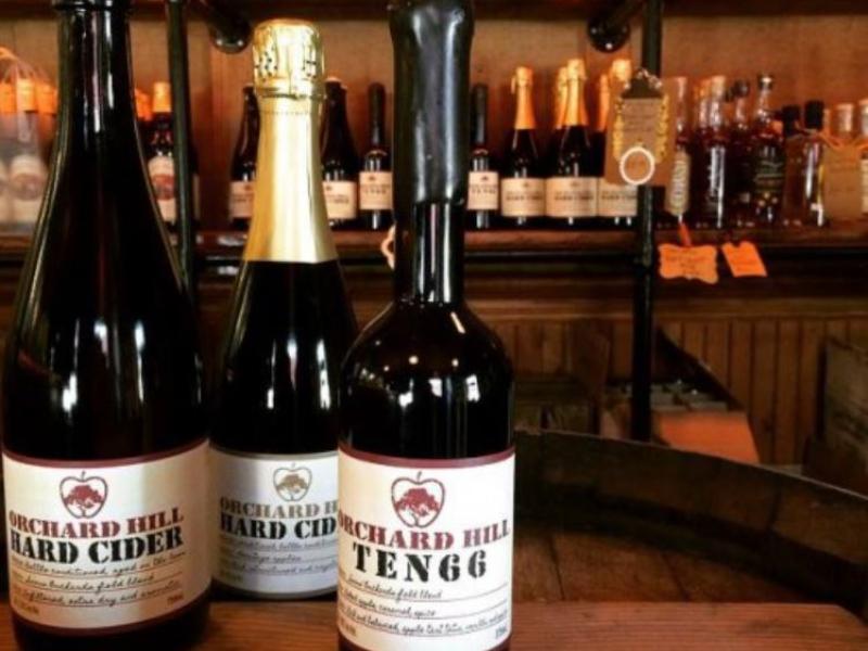bottles of cider on a table