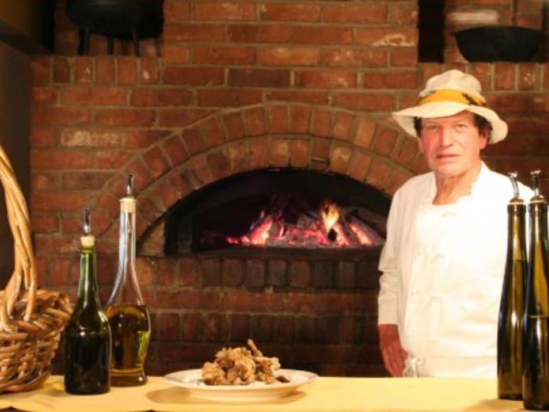man by brick oven