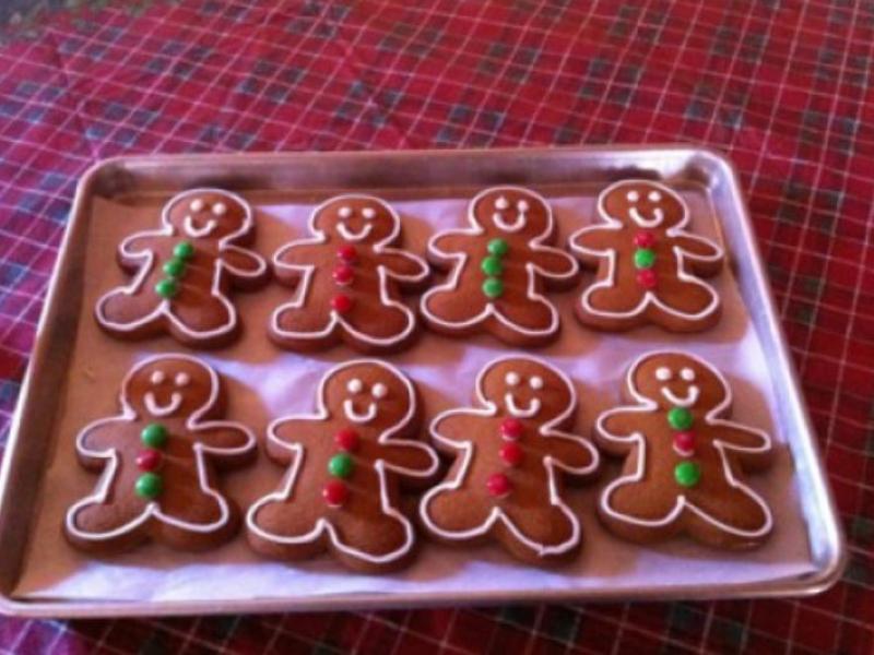 gingerbread men cookies 8 of them on a cookie tray decorated