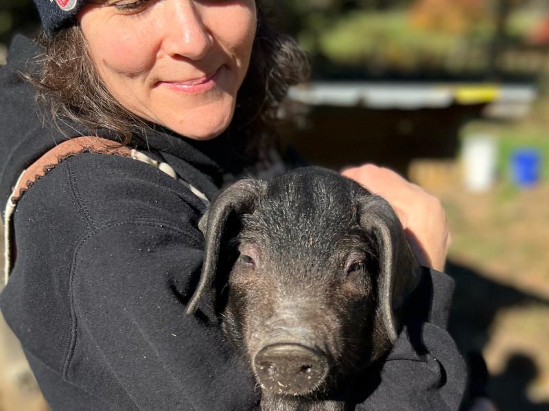 Kristin holding a pig