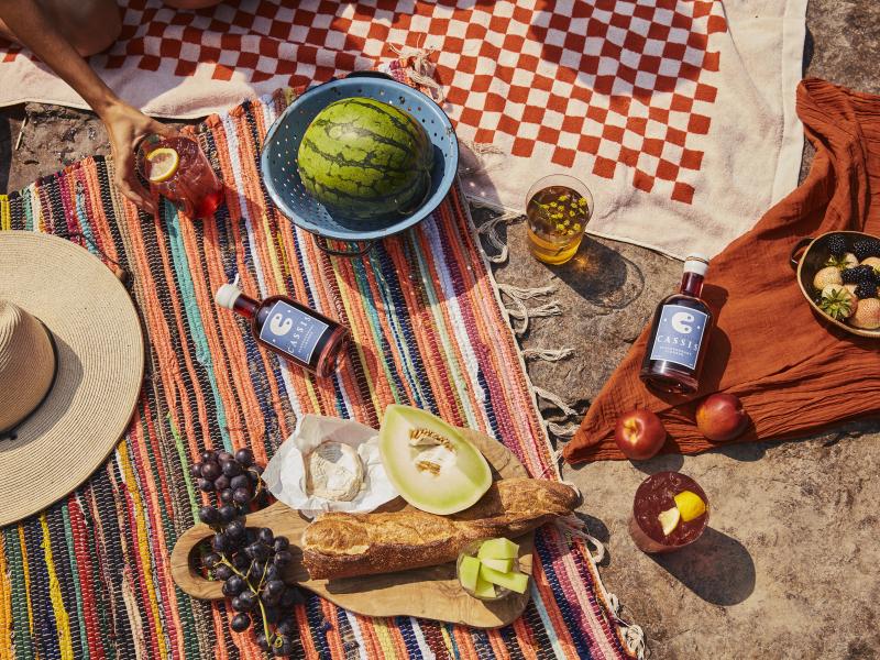 picnic with currant cassis there is a watermelon and cheese