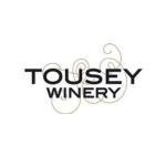 Logo white background with black lettering Tousey Winery with a etched grape vine in plum behind the lettering