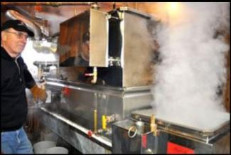 man boiling maple