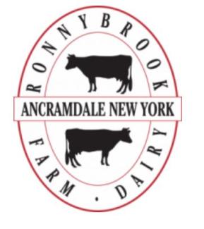 logo red oval with 2 cows one on top one on bottom with name of town in middle and name of company around