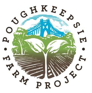 logo circle with wording around outside of circle, dirt with mountain background