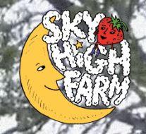 logo of a half moon with sky high farm in white like clouds with a strawberry on top